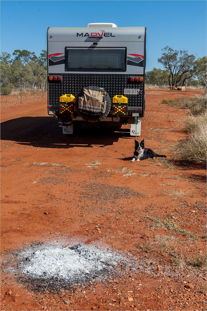 Remains of a campfire evening on the roadside north of Winton, Outback Qld